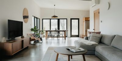 a living room filled with furniture and a flat screen tv